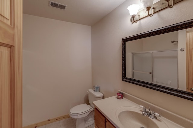 7621 Winter Trl, Breezy Point, MN 56472 - full bath with tile patterned flooring, toilet, a shower with shower door, and vanity