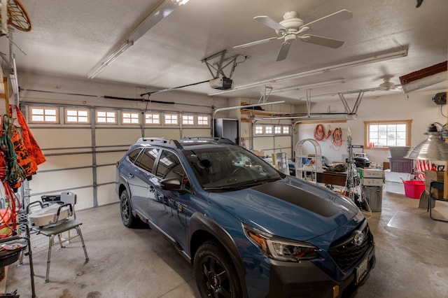 7621 Winter Trl, Breezy Point, MN 56472 - garage featuring a garage door opener and a ceiling fan