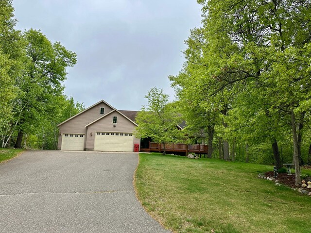 7621 Winter Trl, Breezy Point, MN 56472 - view of front of home with a front yard, driveway, and a deck