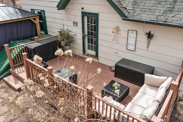 deck featuring outdoor lounge area