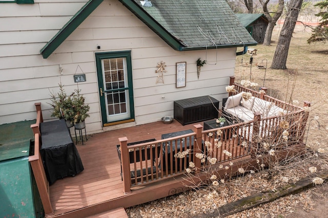 wooden deck with an outdoor living space