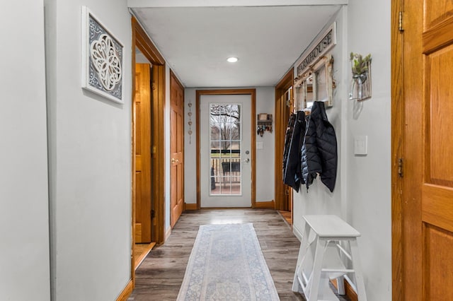 mudroom featuring baseboards, wood finished floors, and recessed lighting
