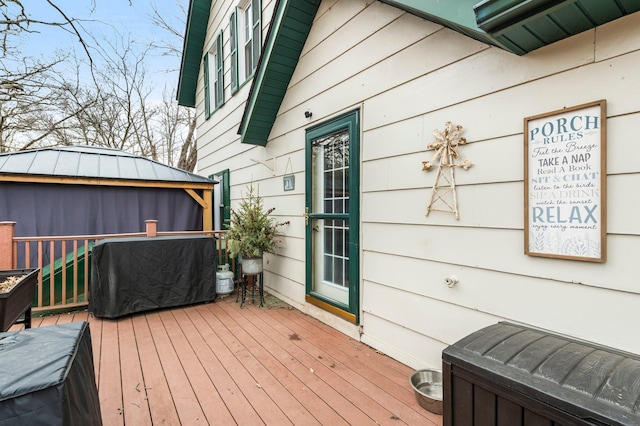 wooden deck with a gazebo