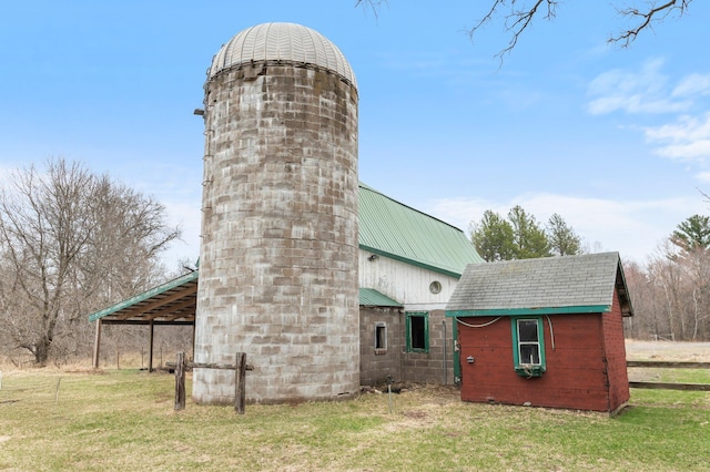 view of outdoor structure featuring fence