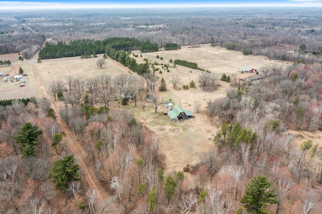 aerial view with a rural view and a wooded view