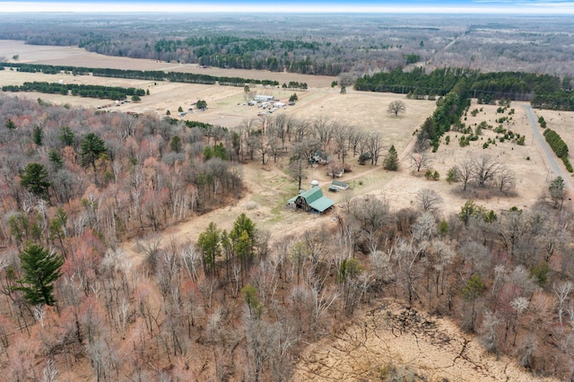 drone / aerial view with a forest view and a rural view