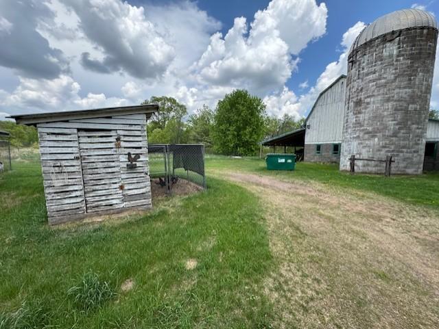 2908 River Rd, Saint Croix Falls, WI 54024 - view of grassy yard featuring an outbuilding and a barn
