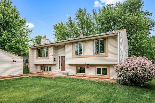 11560 Red Fox Dr, Maple Grove, MN 55369 - raised ranch with a chimney and a front lawn