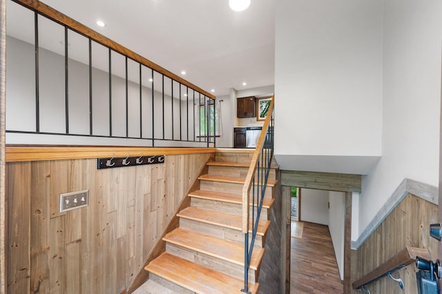 11560 Red Fox Dr, Maple Grove, MN 55369 - stairs featuring wood finished floors, recessed lighting, and wooden walls