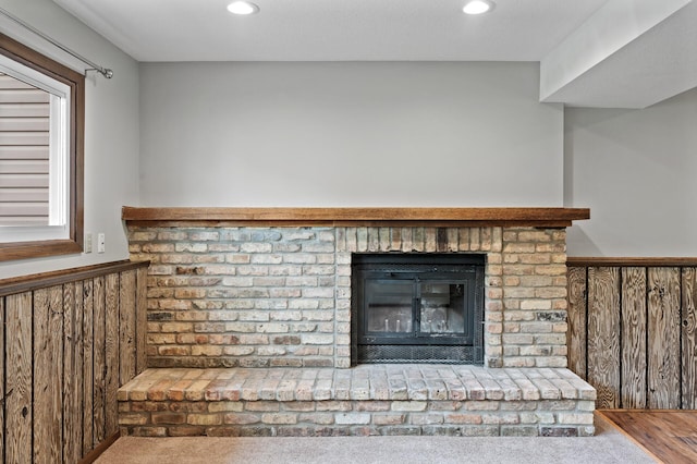 11560 Red Fox Dr, Maple Grove, MN 55369 - detailed view of wainscoting, recessed lighting, a fireplace, and carpet floors