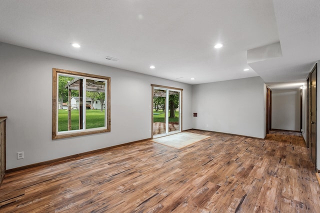 11560 Red Fox Dr, Maple Grove, MN 55369 - spare room featuring wood finished floors, plenty of natural light, recessed lighting, and baseboards