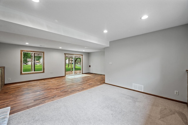 11560 Red Fox Dr, Maple Grove, MN 55369 - empty room featuring carpet floors, recessed lighting, baseboards, and wood finished floors