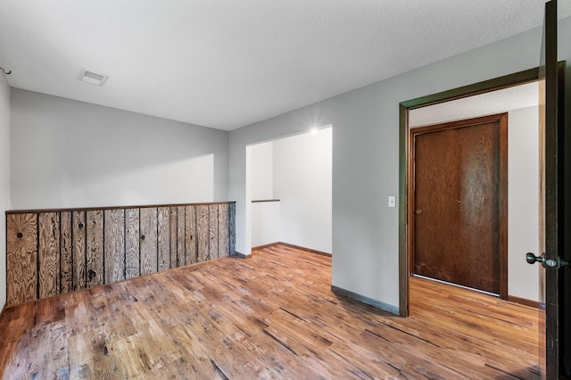 11560 Red Fox Dr, Maple Grove, MN 55369 - empty room featuring wood finished floors and baseboards