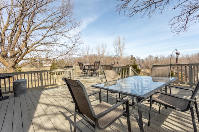 wooden terrace featuring outdoor dining space