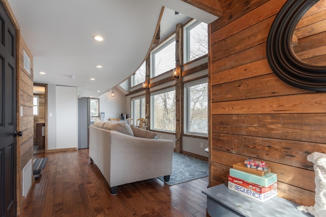 living room featuring recessed lighting, baseboards, lofted ceiling, and dark wood-style floors