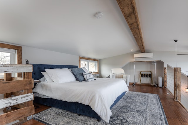 bedroom with multiple windows, a wall mounted AC, and wood finished floors