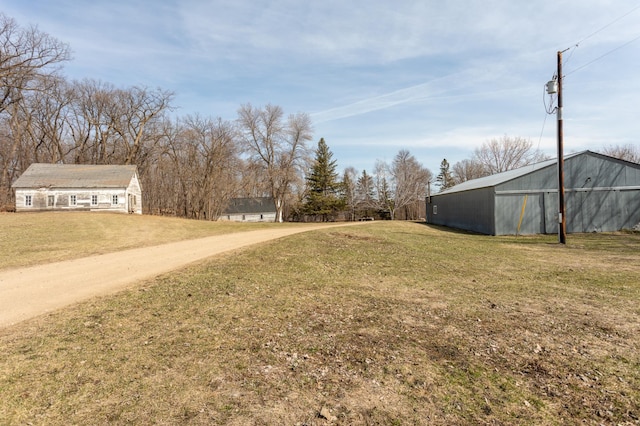 view of yard with an outbuilding and an outdoor structure