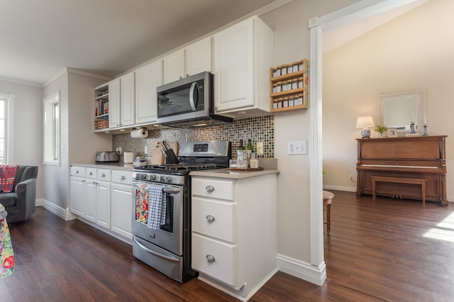 kitchen with decorative backsplash, open shelves, dark wood finished floors, white cabinets, and stainless steel appliances