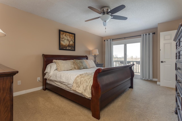 bedroom featuring light carpet, baseboards, access to outside, a textured ceiling, and a ceiling fan