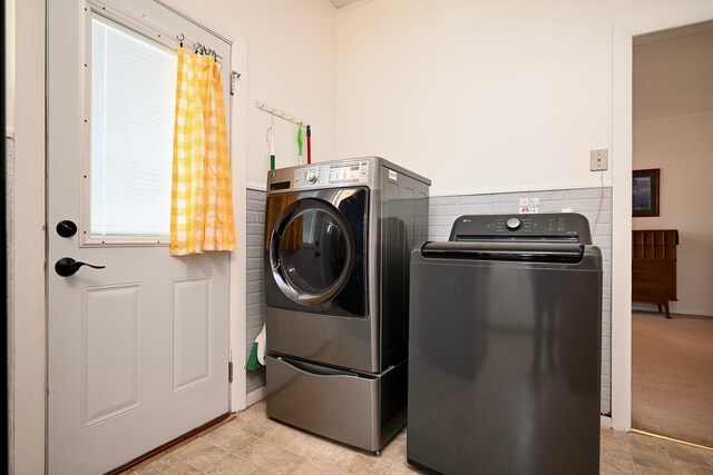 laundry room with washing machine and dryer and laundry area