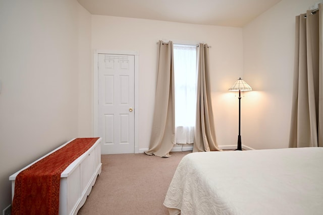 bedroom with light colored carpet