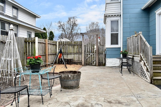 view of patio / terrace featuring fence