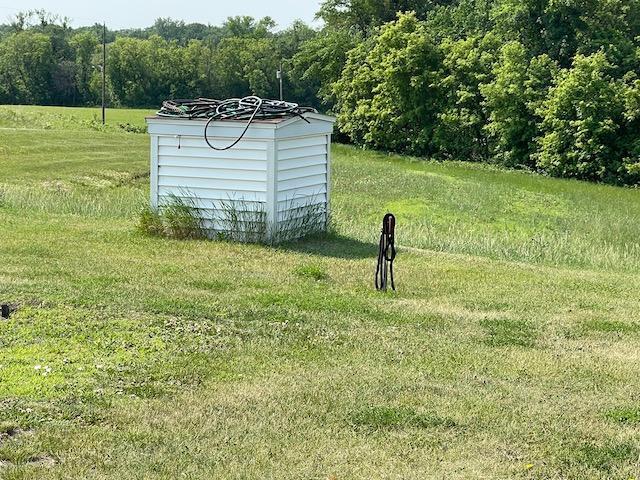 view of outbuilding with a view of trees