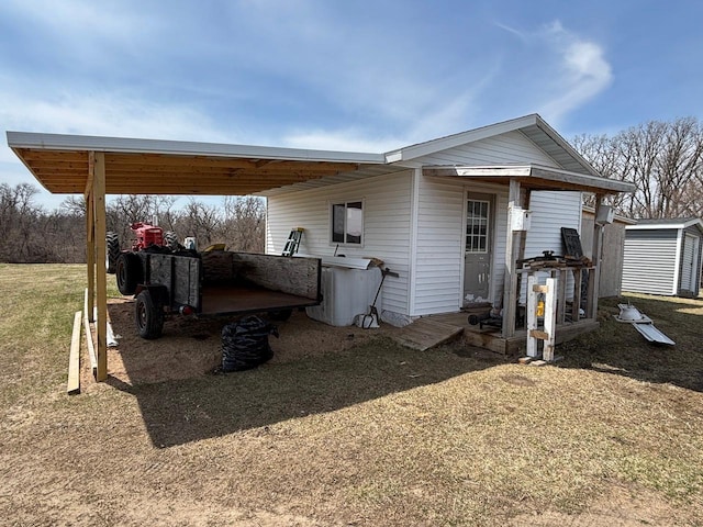 exterior space featuring an outbuilding and a carport