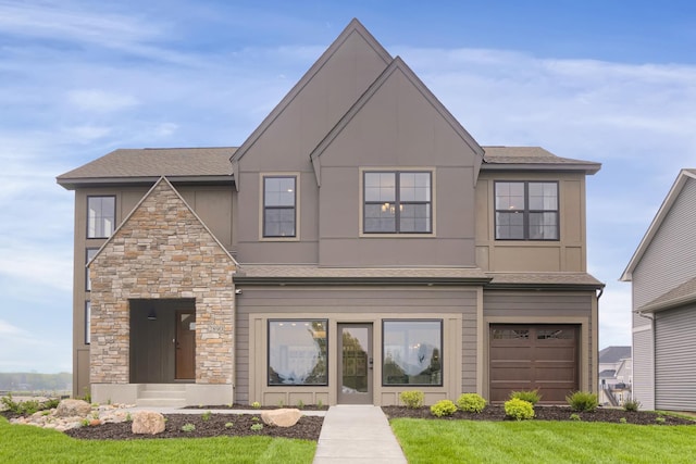 14960 144th Ave N, Dayton, MN 55327 - view of front of house featuring stucco siding, a front lawn, stone siding, and a shingled roof