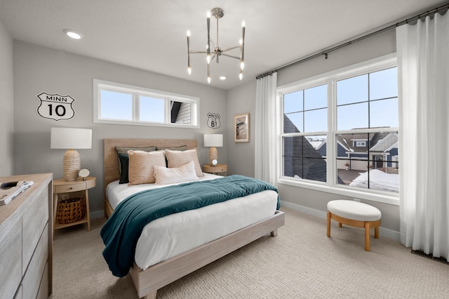 bedroom featuring light carpet, baseboards, an inviting chandelier, and recessed lighting