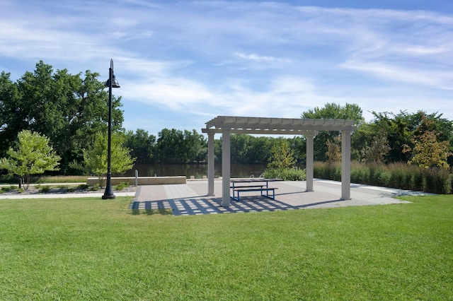 surrounding community featuring a pergola and a yard