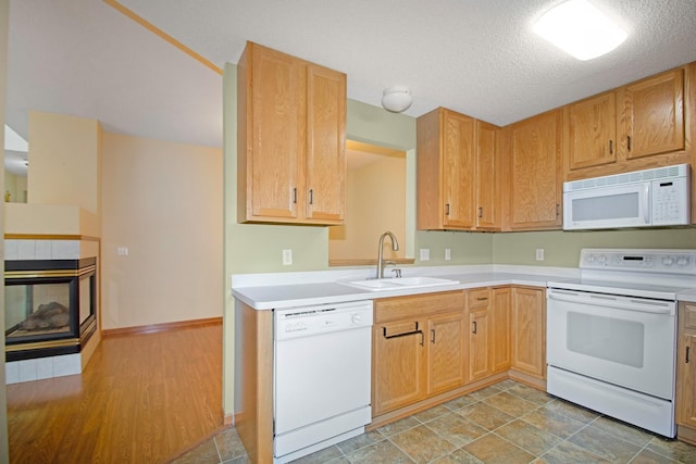 7931 Pinnacle Ave NE, Otsego, MN 55330 - kitchen with white appliances, light countertops, and a textured ceiling