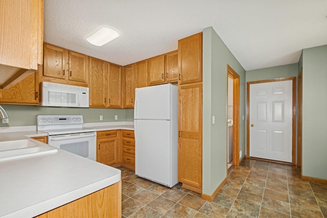 7931 Pinnacle Ave NE, Otsego, MN 55330 - kitchen featuring white appliances and light countertops
