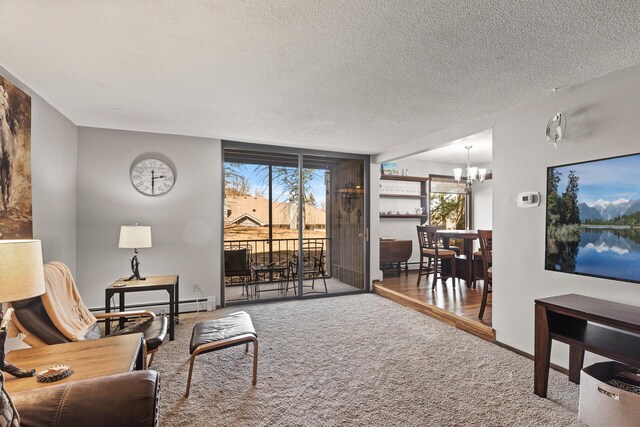 6085 Lincoln Dr Unit 122, Edina, MN 55436 - living room featuring a textured ceiling, baseboards, an inviting chandelier, carpet, and baseboard heating