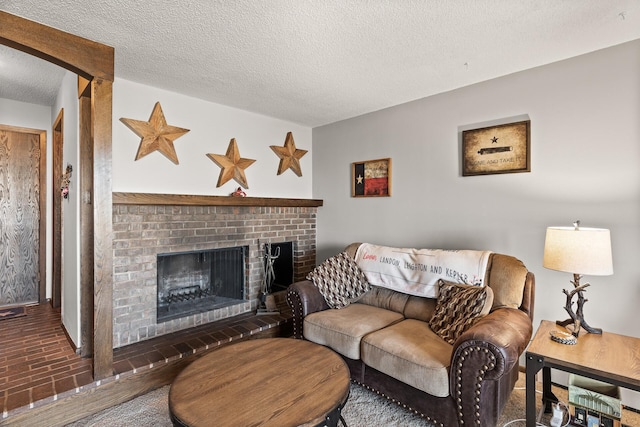 6085 Lincoln Dr Unit 122, Edina, MN 55436 - living room featuring a textured ceiling and a fireplace
