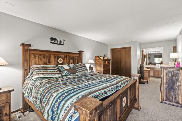 6085 Lincoln Dr Unit 122, Edina, MN 55436 - bedroom with ensuite bath, light carpet, and a closet