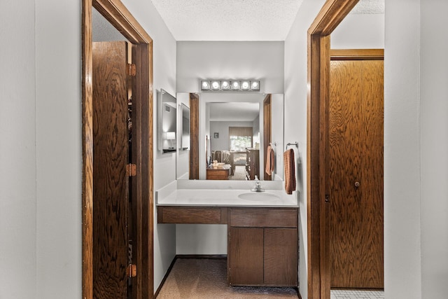 6085 Lincoln Dr Unit 122, Edina, MN 55436 - bathroom featuring connected bathroom, vanity, and a textured ceiling