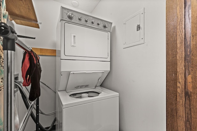 6085 Lincoln Dr Unit 122, Edina, MN 55436 - laundry area featuring stacked washer / drying machine, electric panel, and laundry area