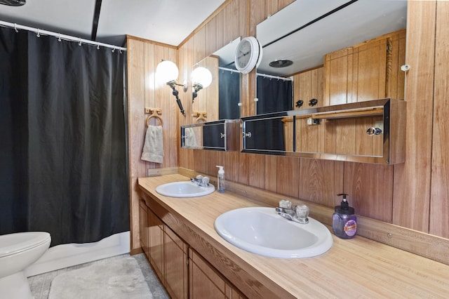 full bathroom with a sink, wooden walls, toilet, and a shower with curtain