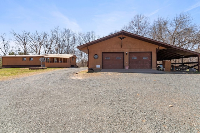 garage with a garage and driveway