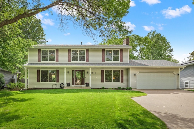 4545 Terraceview Ln N, Plymouth, MN 55446 - view of front of house featuring a garage, driveway, a chimney, and a front lawn