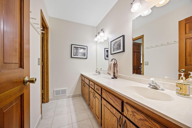 4545 Terraceview Ln N, Plymouth, MN 55446 - full bathroom featuring tile patterned floors, double vanity, and baseboards