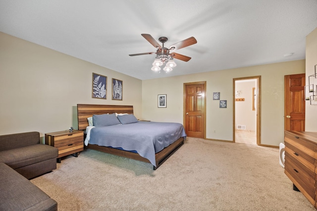 4545 Terraceview Ln N, Plymouth, MN 55446 - carpeted bedroom with baseboards, ensuite bathroom, and a ceiling fan