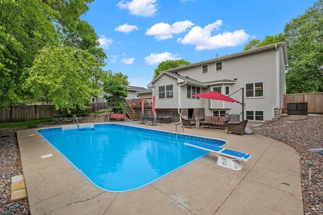 4545 Terraceview Ln N, Plymouth, MN 55446 - view of pool featuring outdoor lounge area, a fenced backyard, a deck, a patio area, and a diving board