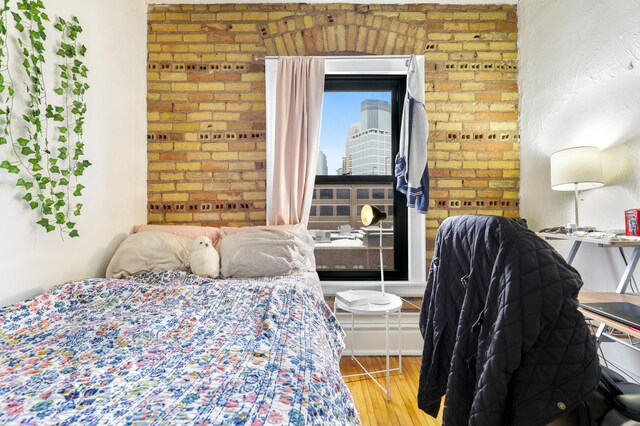 bedroom with wood finished floors