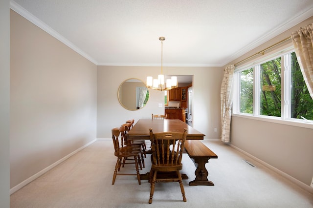 2806 Jasmine Ct, Saint Cloud, MN 56301 - dining room featuring crown molding, a chandelier, baseboards, and light carpet