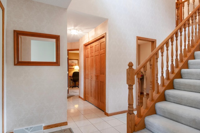 2806 Jasmine Ct, Saint Cloud, MN 56301 - foyer entrance with baseboards, stairs, and light tile patterned floors