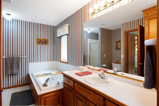 2806 Jasmine Ct, Saint Cloud, MN 56301 - full bathroom with wallpapered walls, vanity, a whirlpool tub, and a stall shower