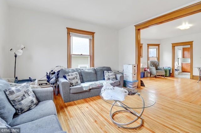 living area with hardwood / wood-style flooring