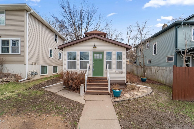 2943 Taylor St NE, Minneapolis, MN 55418 - view of front of house featuring fence and entry steps